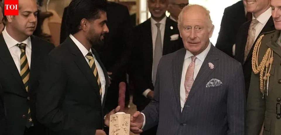 Rencontre entre des joueurs et le roi Charles III