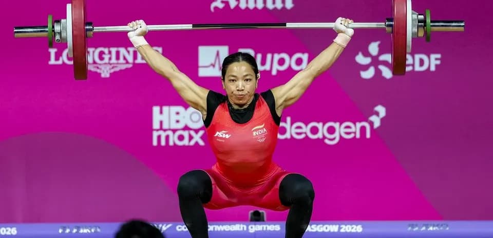 Athlete lifting barbell during weightlifting competition