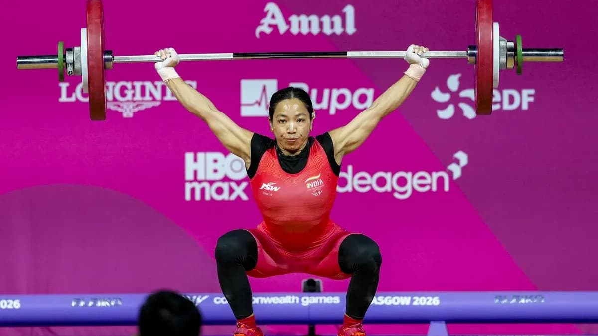 Athlete lifting barbell during weightlifting competition