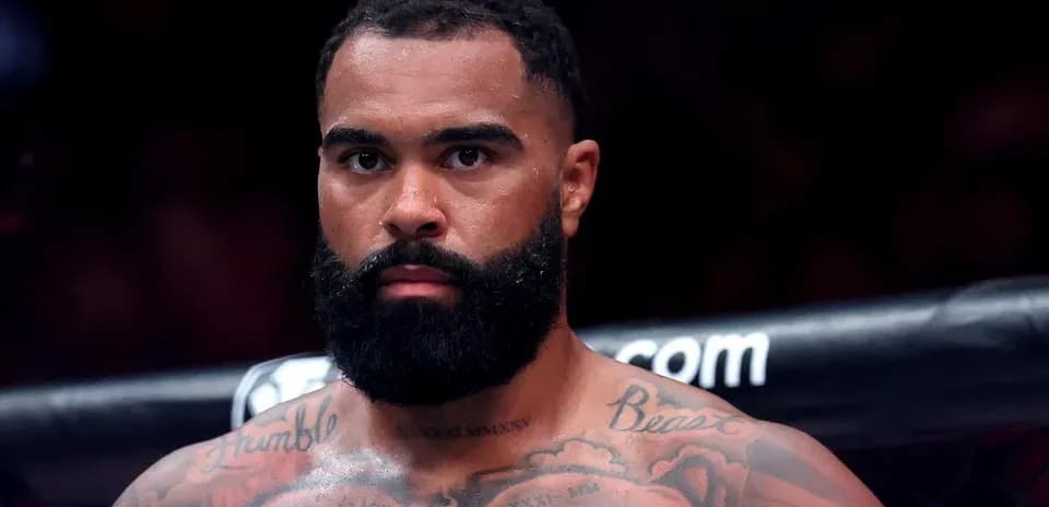 Fighter with tattoos preparing for a match