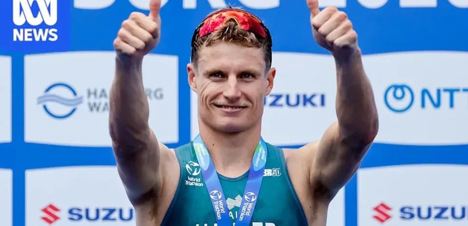 Athlete celebrating with thumbs up at event