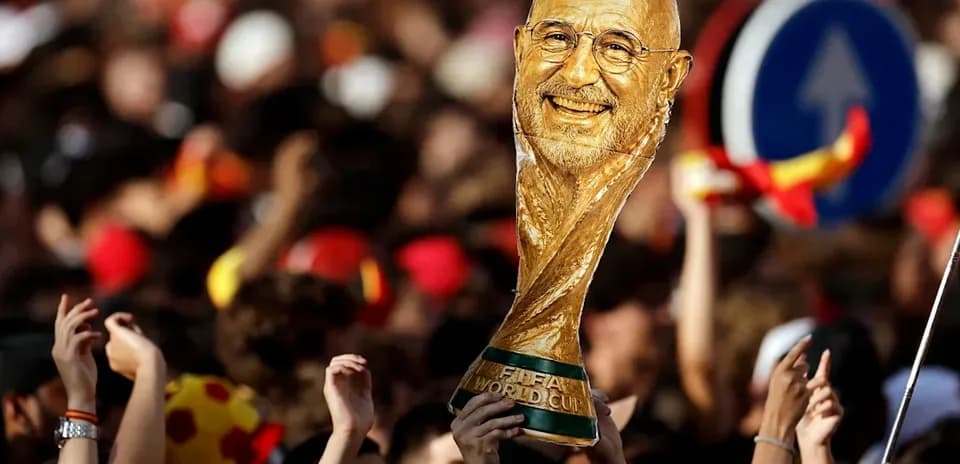 Supporters celebrating with World Cup trophy in crowd