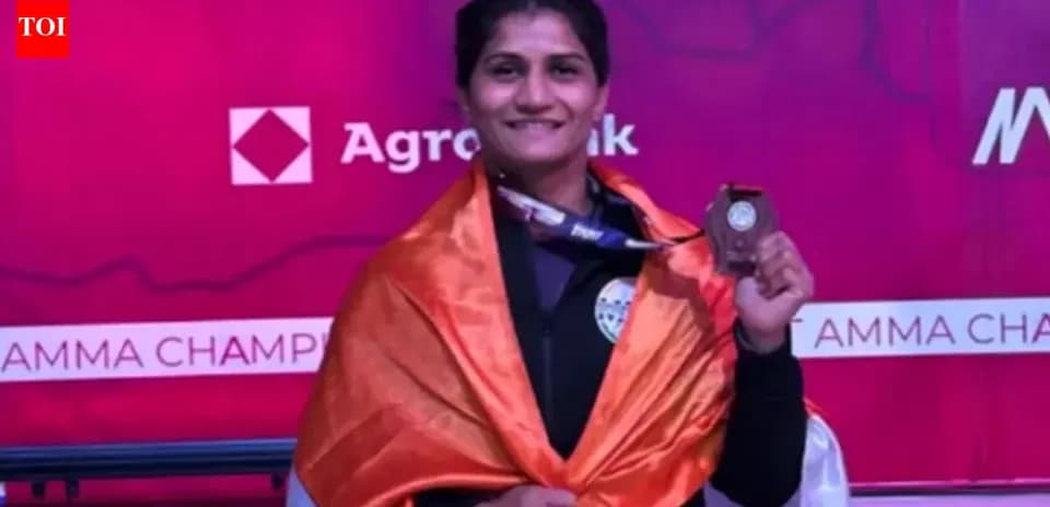 Athlete celebrating with medal and national flag