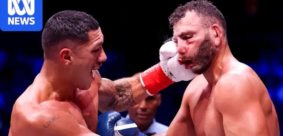 Boxer landing a punch on opponent's face