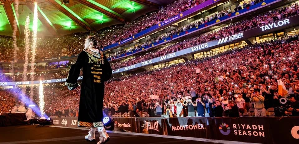 Boxer entering arena with fireworks and crowd cheering