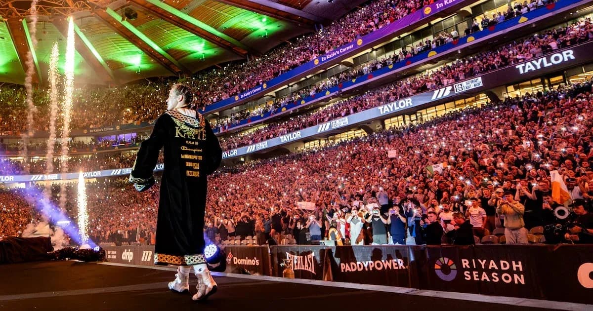 Boxer entering arena with fireworks and crowd cheering