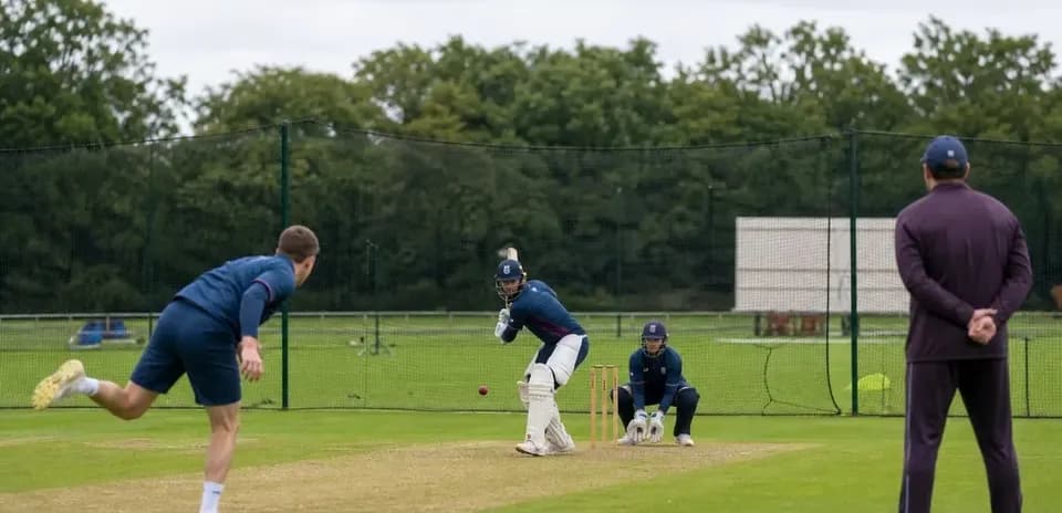 Batsman facing bowler during cricket training session