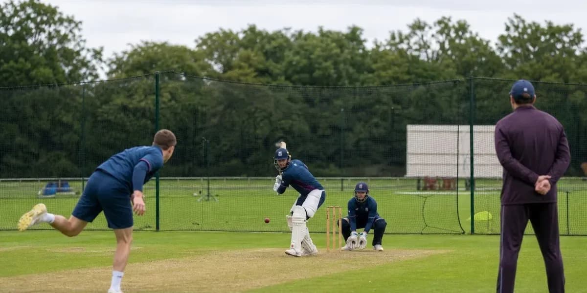 Batsman facing bowler during cricket training session