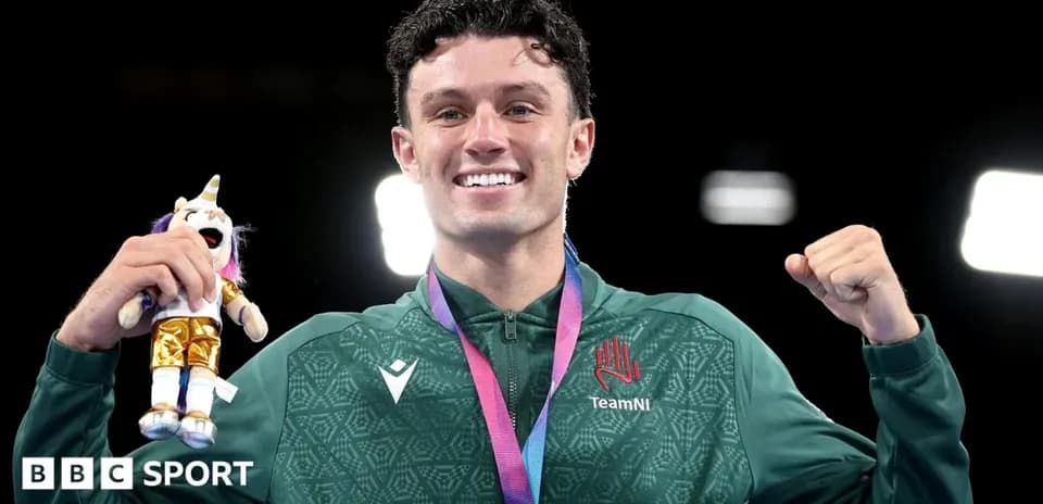 Athlete celebrating with medal and plush toy