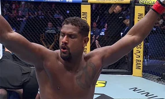 Fighter celebrating victory in the octagon