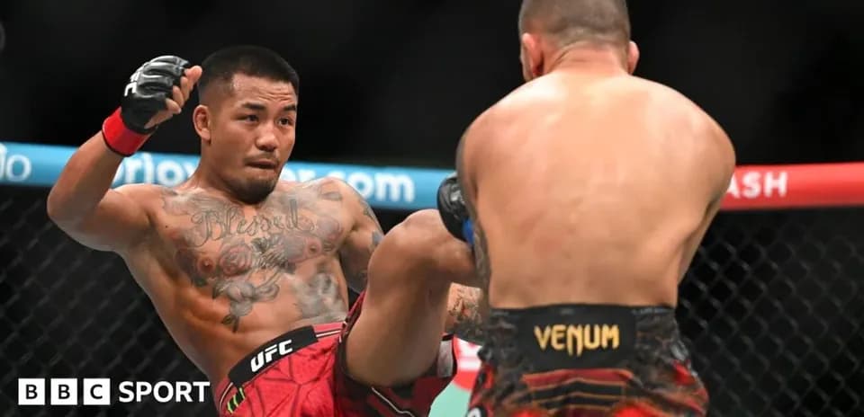 Fighter delivering a kick during UFC match