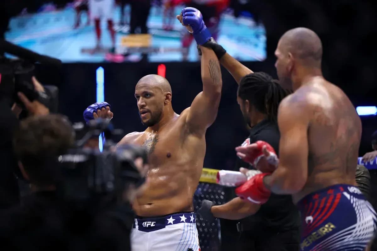 Fighter celebrating victory after match in octagon