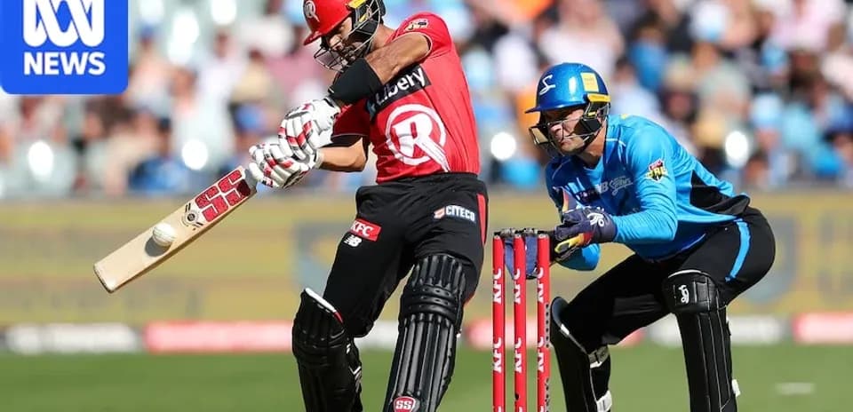 Batsman hitting the ball while wicketkeeper crouches