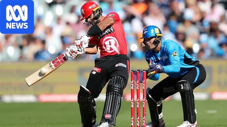 Batsman hitting the ball while wicketkeeper crouches