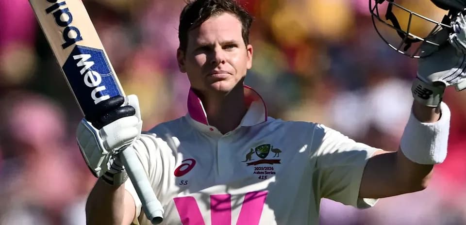 Steve Smith celebrating a century with raised bat