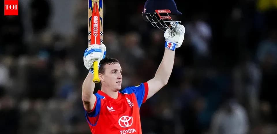 Joueur de cricket levant sa batte après un score