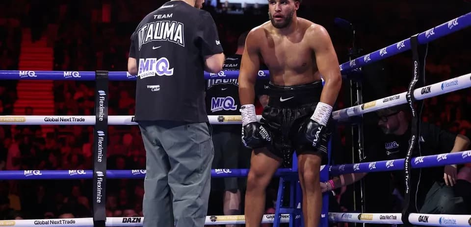 Boxer sitting on stool during corner break