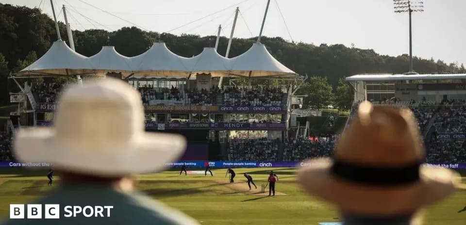 Spectators watching cricket match at stadium
