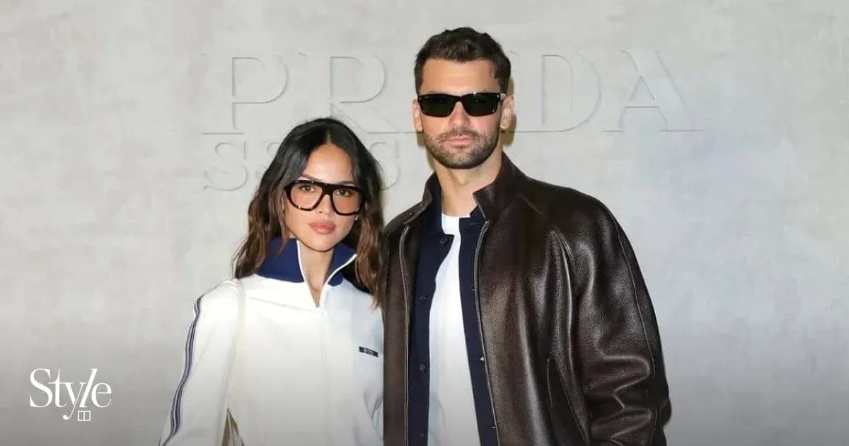 Couple posing together at fashion event