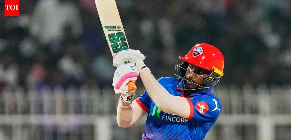 Joueur frappant la balle lors d'un match de cricket