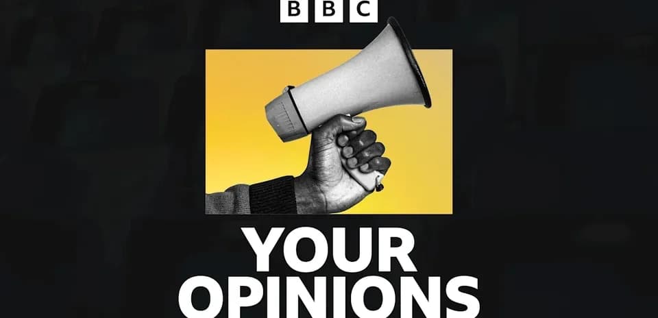 Mainly a hand holding a megaphone against yellow background