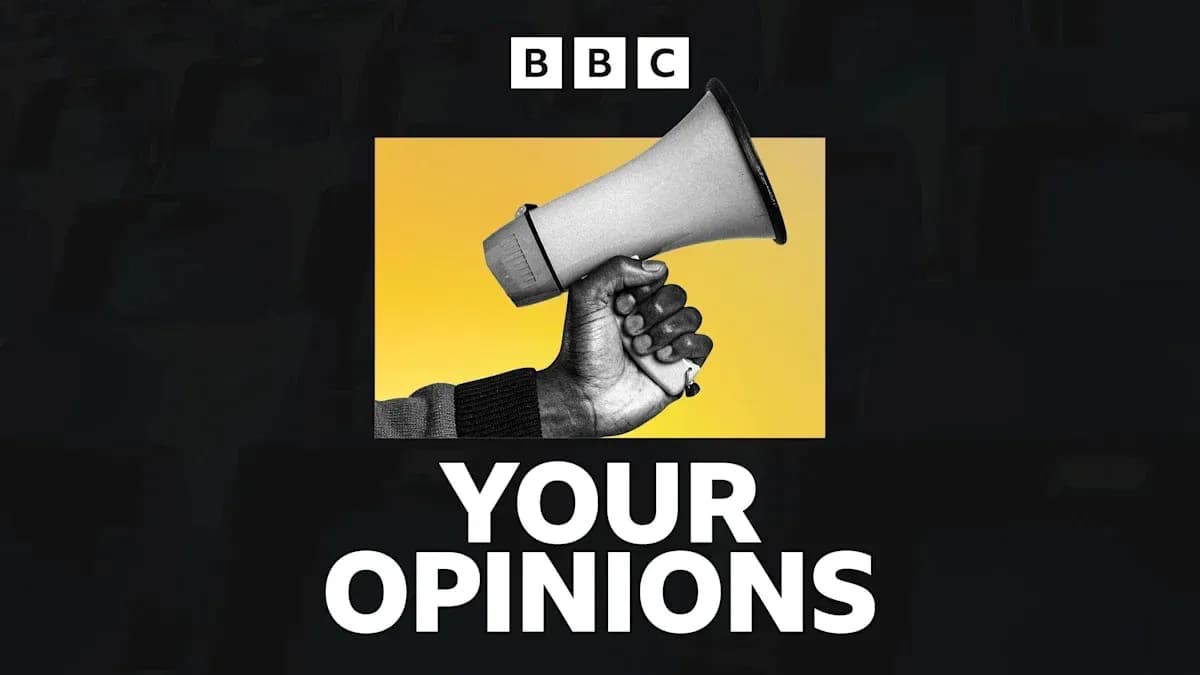Mainly a hand holding a megaphone against yellow background