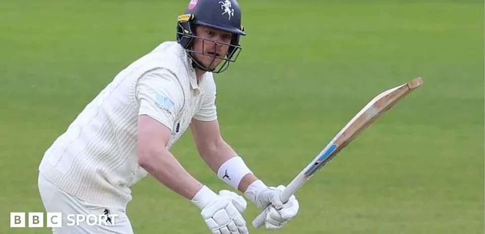 Batteur en action sur le terrain de cricket
