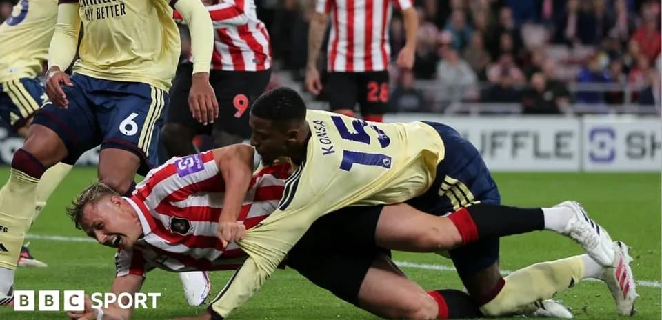 Joueurs en lutte au sol lors d'un match