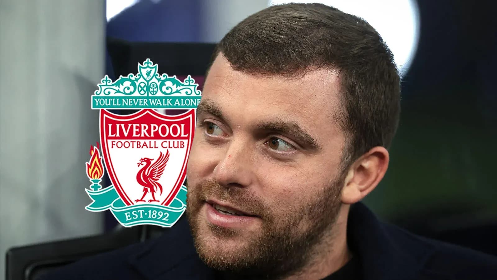 Person speaking with Liverpool FC logo in background