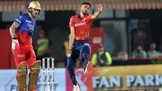Bowler delivering ball with batsman in stance Bowler delivering ball with batsman in stance