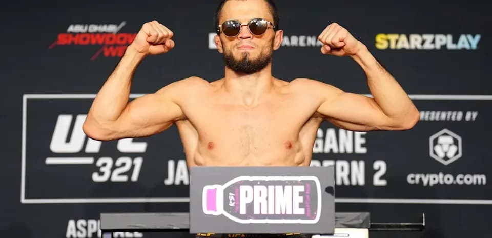 Fighter flexing muscles at UFC weigh-in event