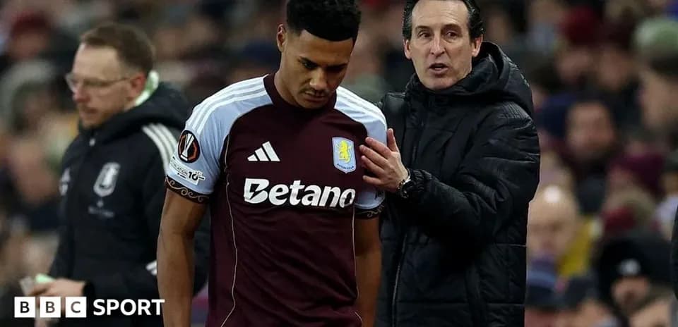 Entraîneur discutant avec un joueur d'Aston Villa