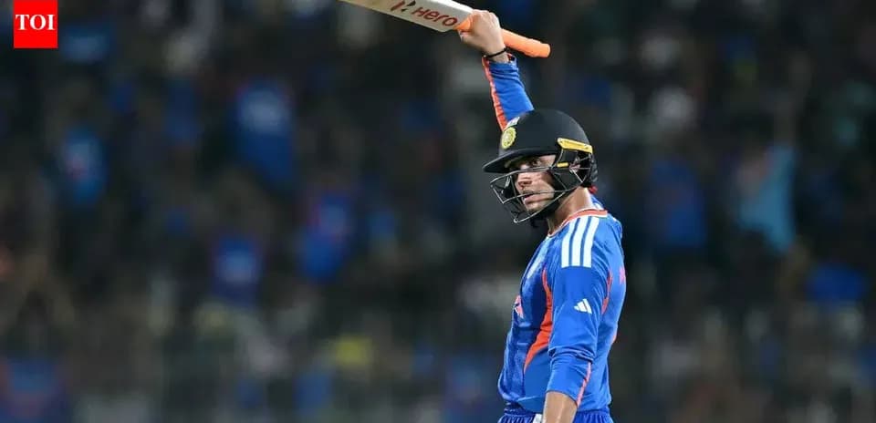 Joueur de cricket levant sa batte en célébration