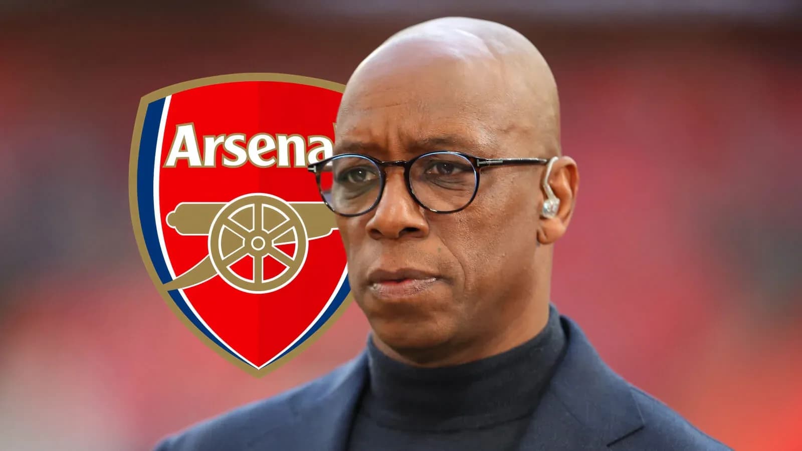 Homme en costume avec logo d'Arsenal en arrière-plan Homme en costume avec logo d'Arsenal en arrière-plan