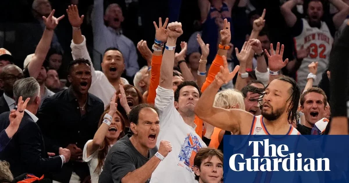 Spectators cheering enthusiastically at a basketball game Spectators cheering enthusiastically at a basketball game