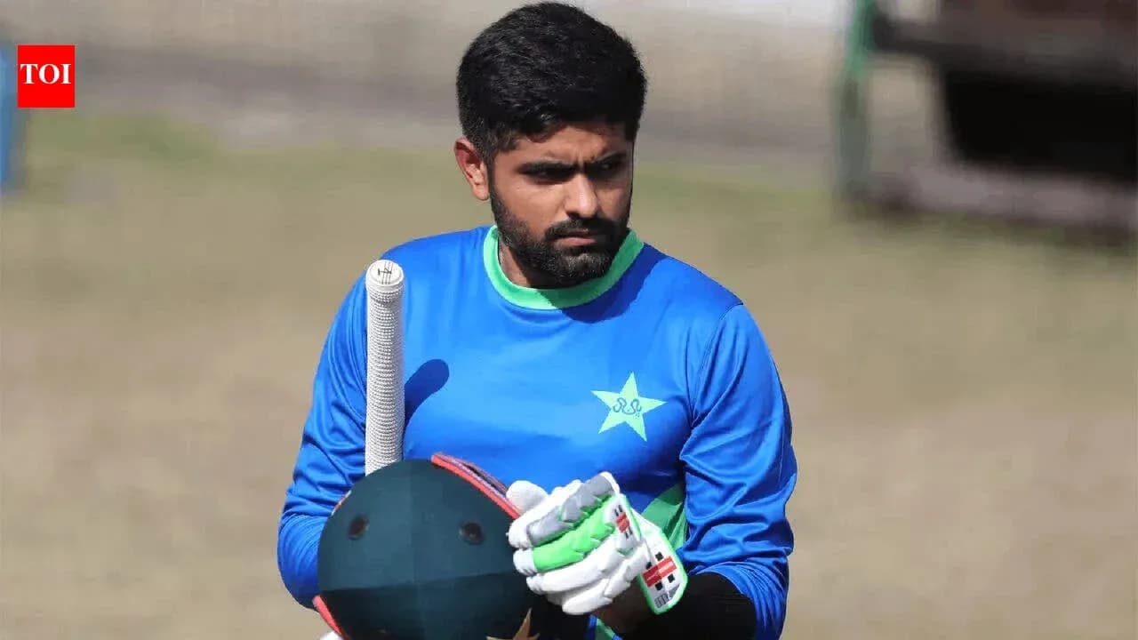 Batsman preparing for practice in cricket gear Batsman preparing for practice in cricket gear