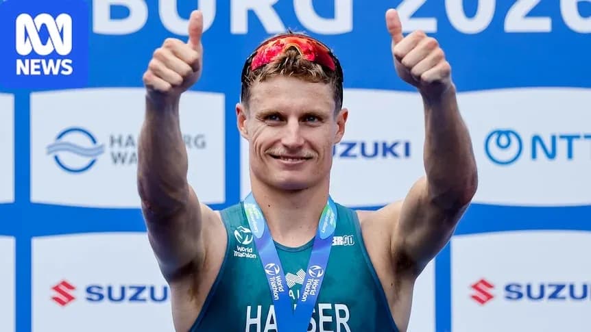 Athlete celebrating with thumbs up at event Athlete celebrating with thumbs up at event