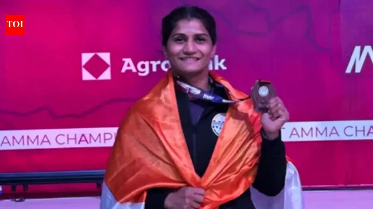 Athlete celebrating with medal and national flag Athlete celebrating with medal and national flag