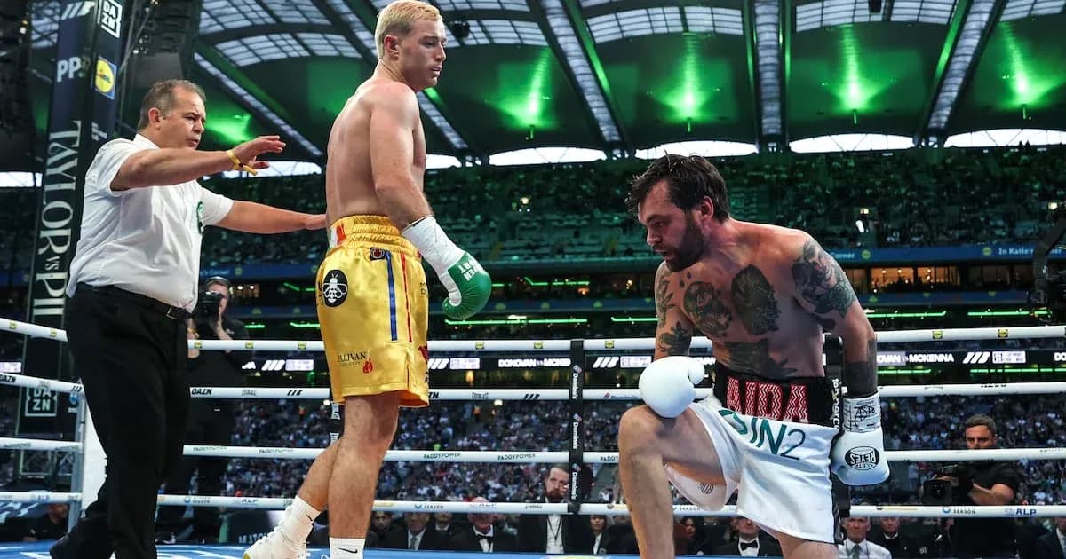 Boxers in ring with referee during match Boxers in ring with referee during match