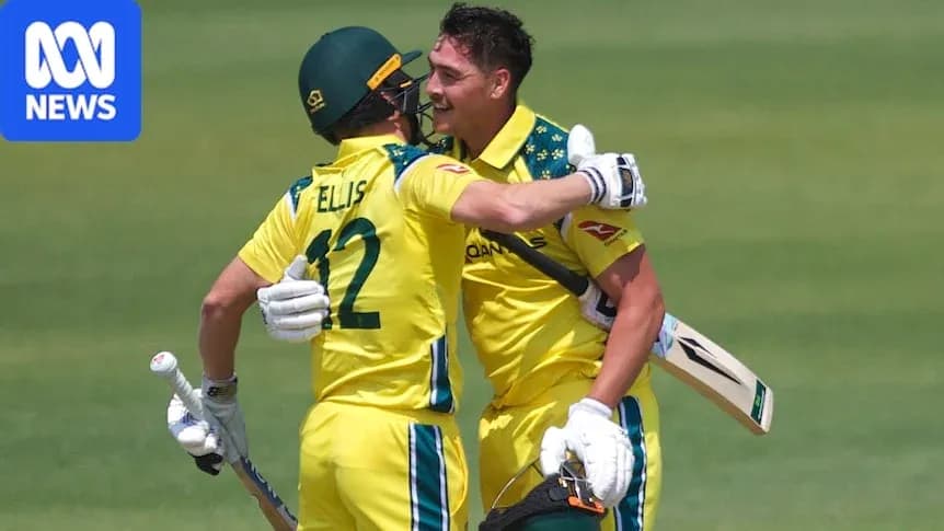 Deux joueurs australiens se félicitent après un point Deux joueurs australiens se félicitent après un point