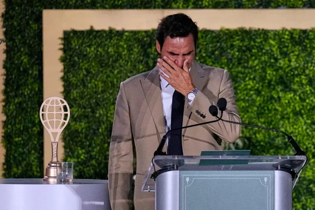 Roger Federer at podium during emotional speech Roger Federer at podium during emotional speech