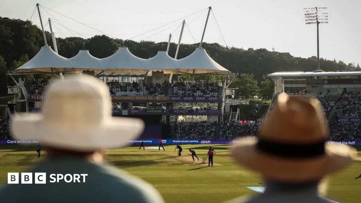 Spectators watching cricket match at stadium Spectators watching cricket match at stadium