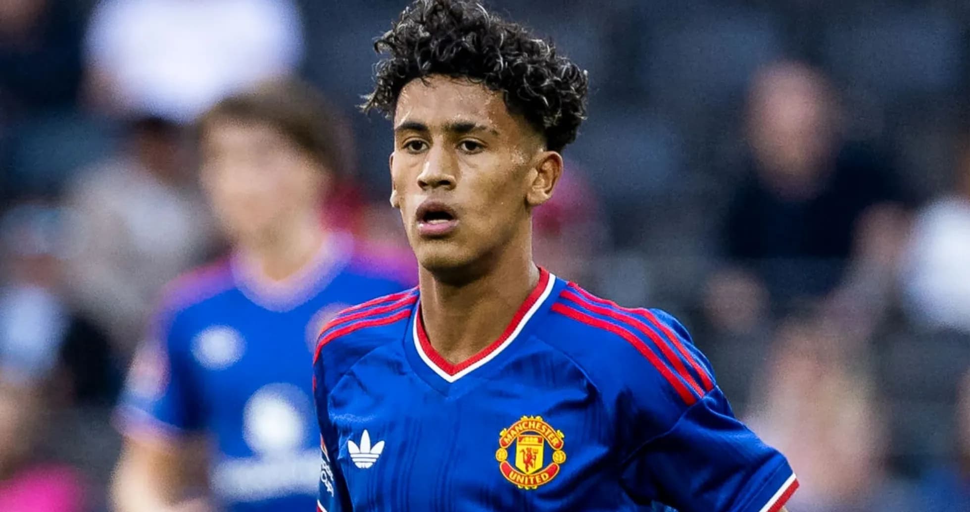 Joueur de Manchester United en action sur le terrain Joueur de Manchester United en action sur le terrain