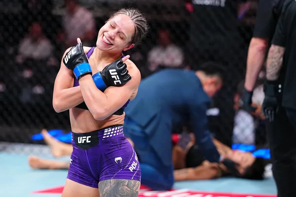 Fighter celebrating victory after match in octagon Fighter celebrating victory after match in octagon