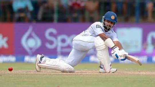 Batsman playing a defensive shot in cricket match Batsman playing a defensive shot in cricket match