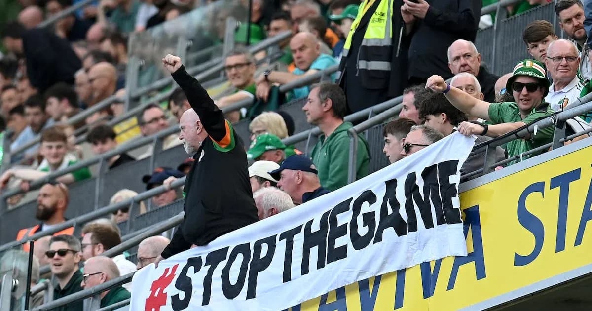 Supporters holding a banner in the stands Supporters holding a banner in the stands
