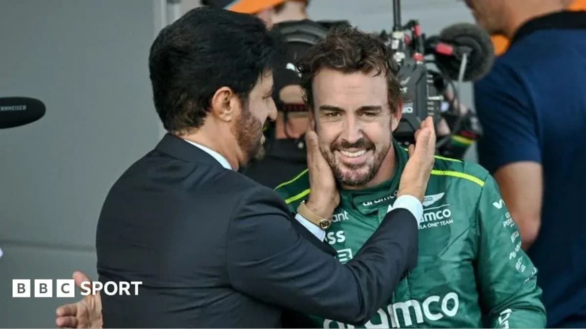Fernando Alonso smiling with teammate after race Fernando Alonso smiling with teammate after race
